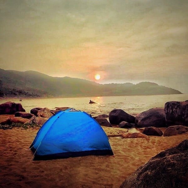 Enjoying the cool sea breeze by the camp at Danang beaches